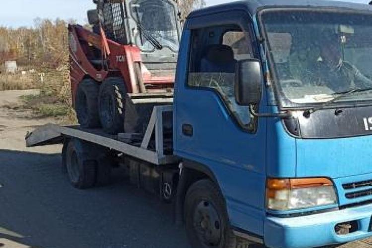 Эвакуатор Isuzu Elf в г. Южноуральск с лебедкой и с ломаной платформой.