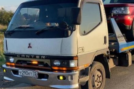 Эвакуатор Mitsubishi Fuso canter  в городе Тюмень со сдвижной платформой, подкатными и лебёдкой